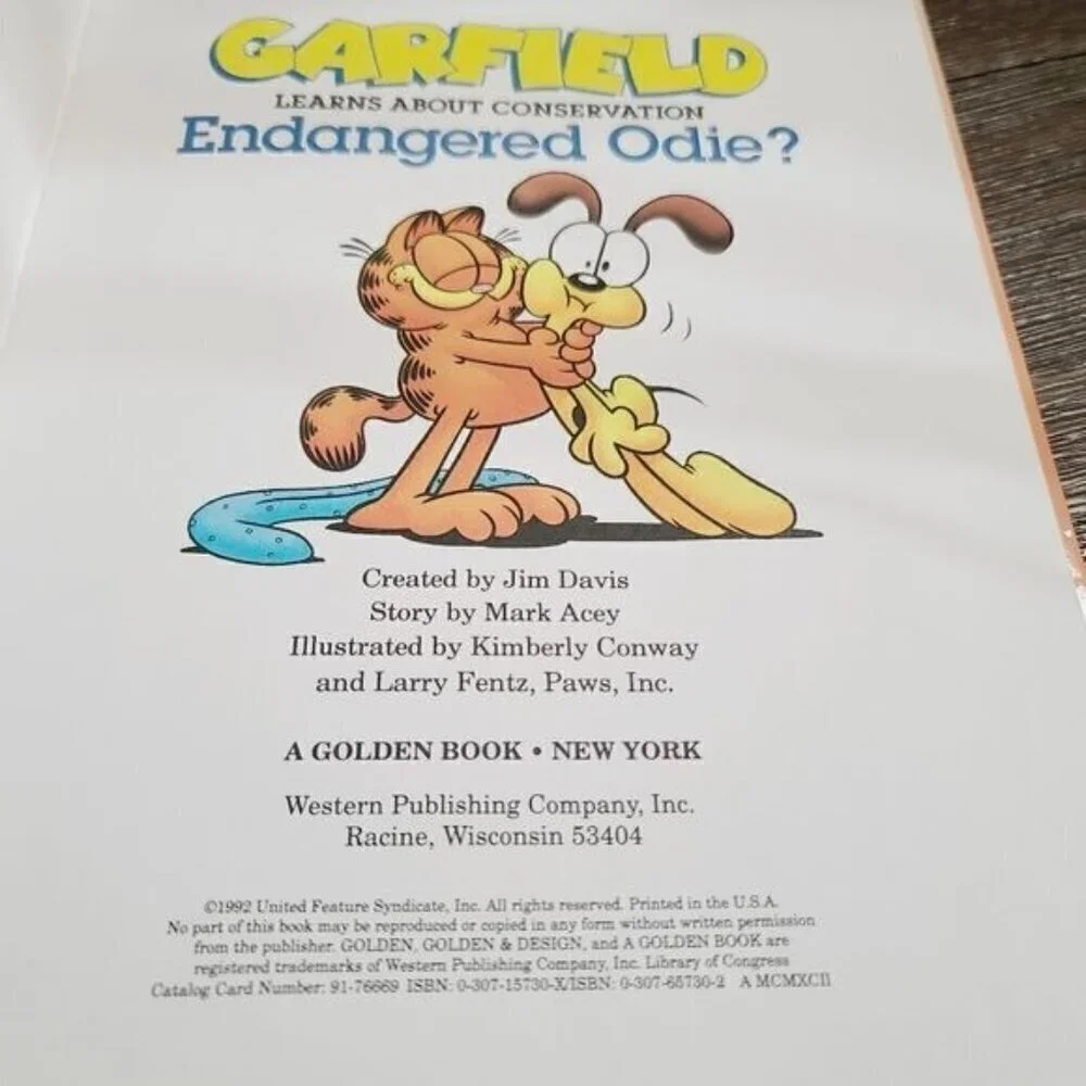Lot of 2 Vintage Garfield Cartoon Books Endangered Odie Surprise Party